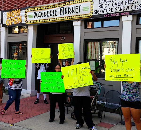 Employees and vendors protest at the Playhouse Market on 8/7/2014